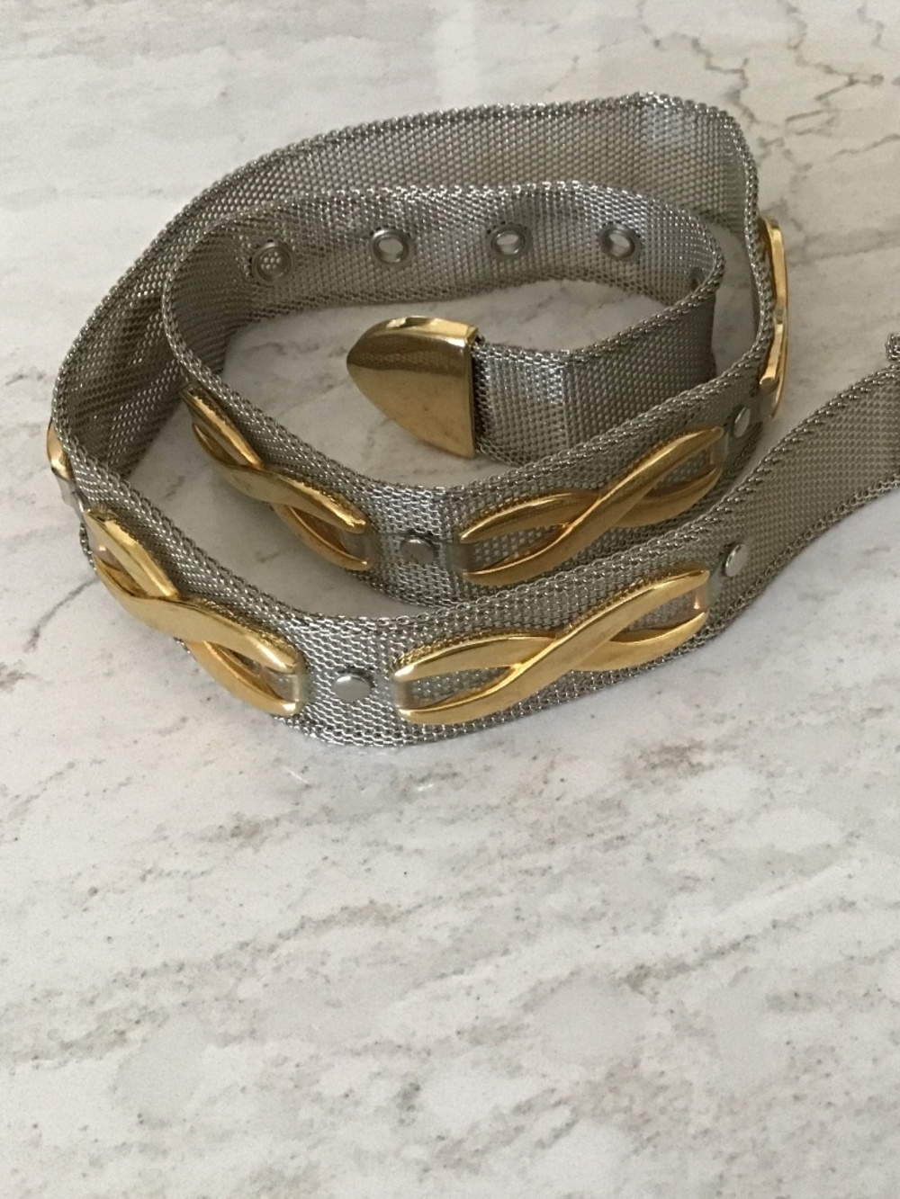 Silver and gold toned metal belt